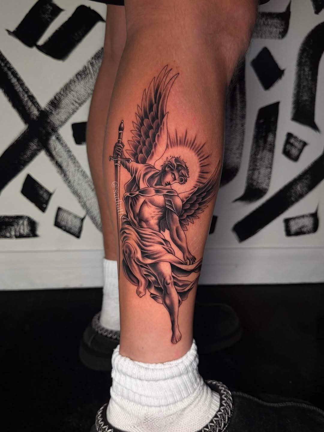 Archangel Michael calf tattoo